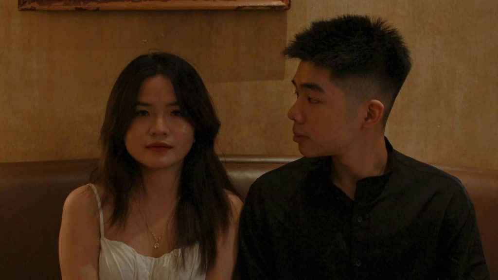 A man looks at a woman.