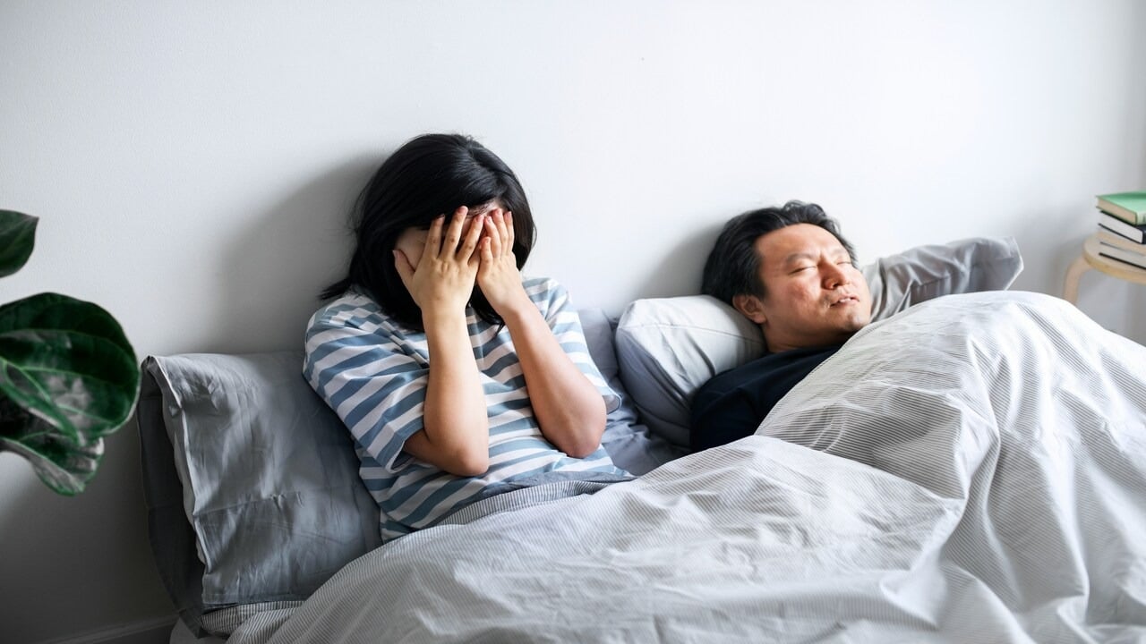 A couple annoyed by her husband