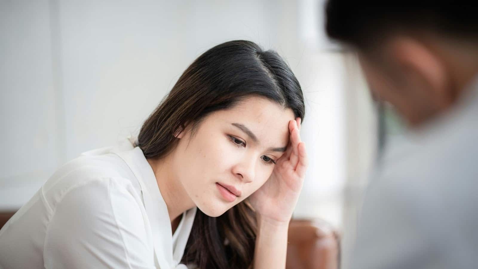 Woman holding her head