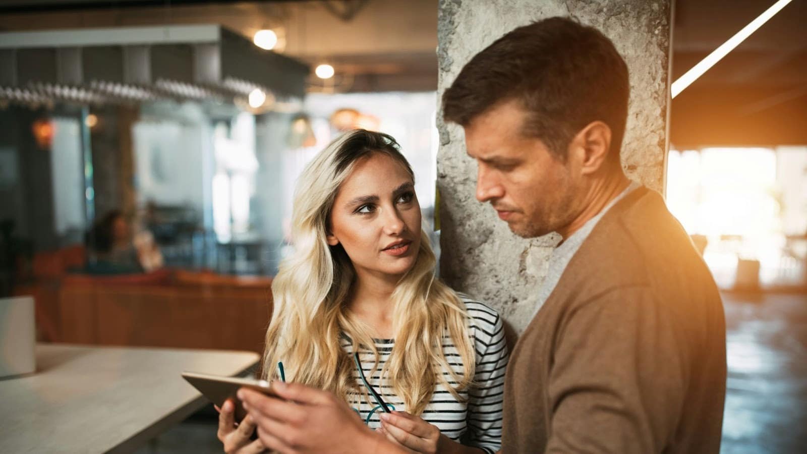A woman looking at a man