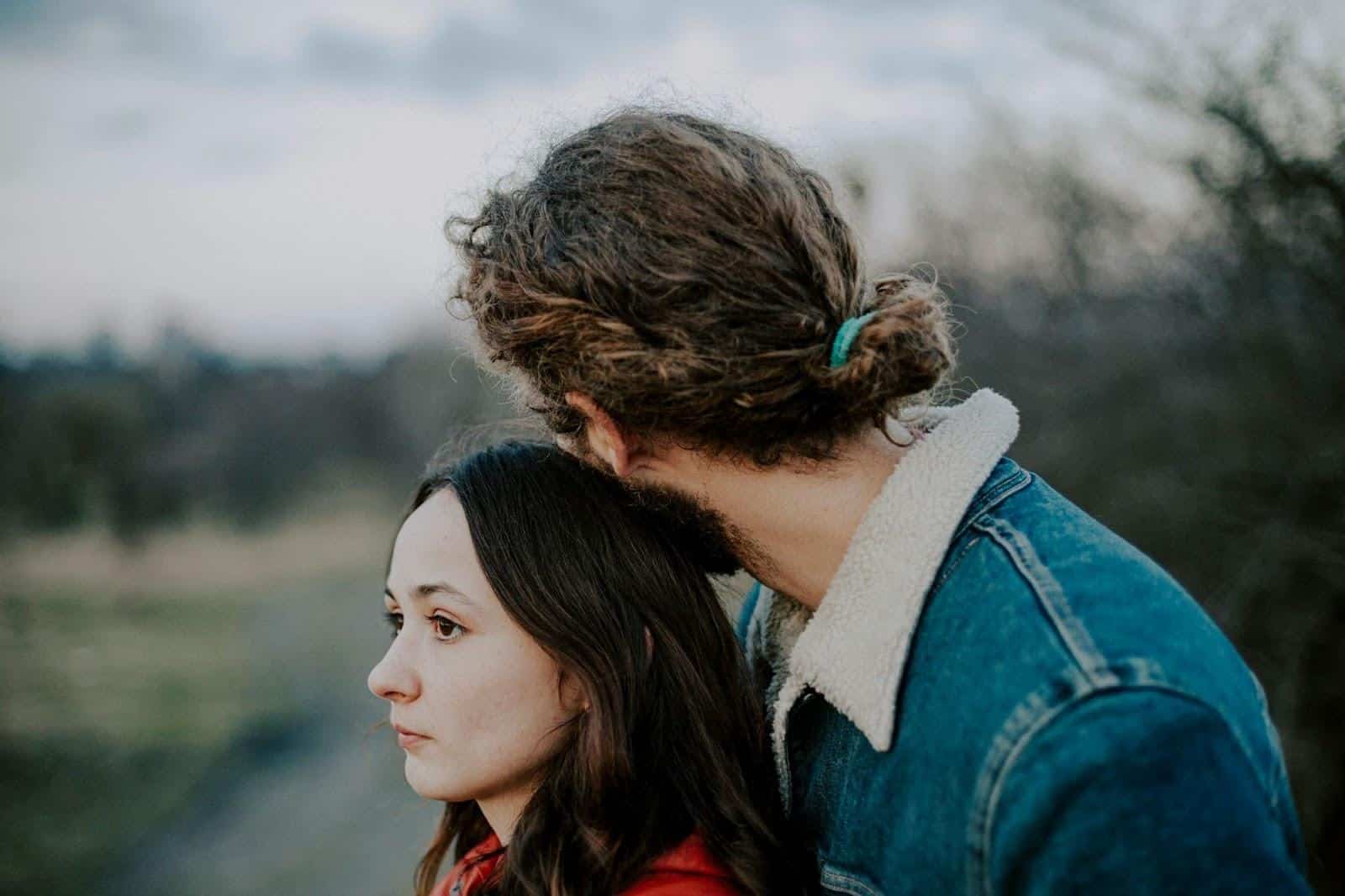 A man hugging a woman