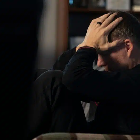 A man holding his head