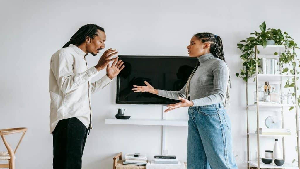 A couple fighting in the living room