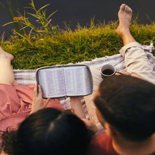 A couple reading the bible together