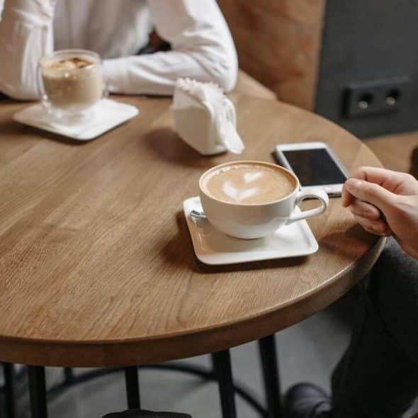 A couple talking over coffee