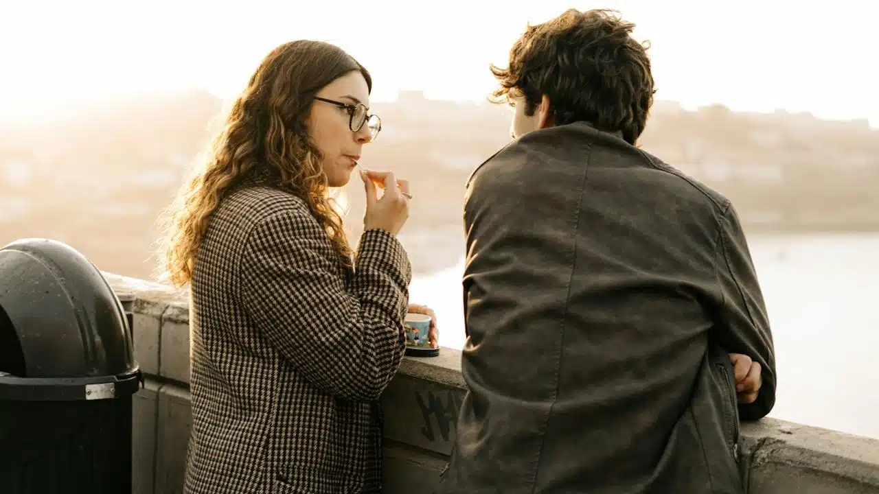 A man and a woman talking to each other.