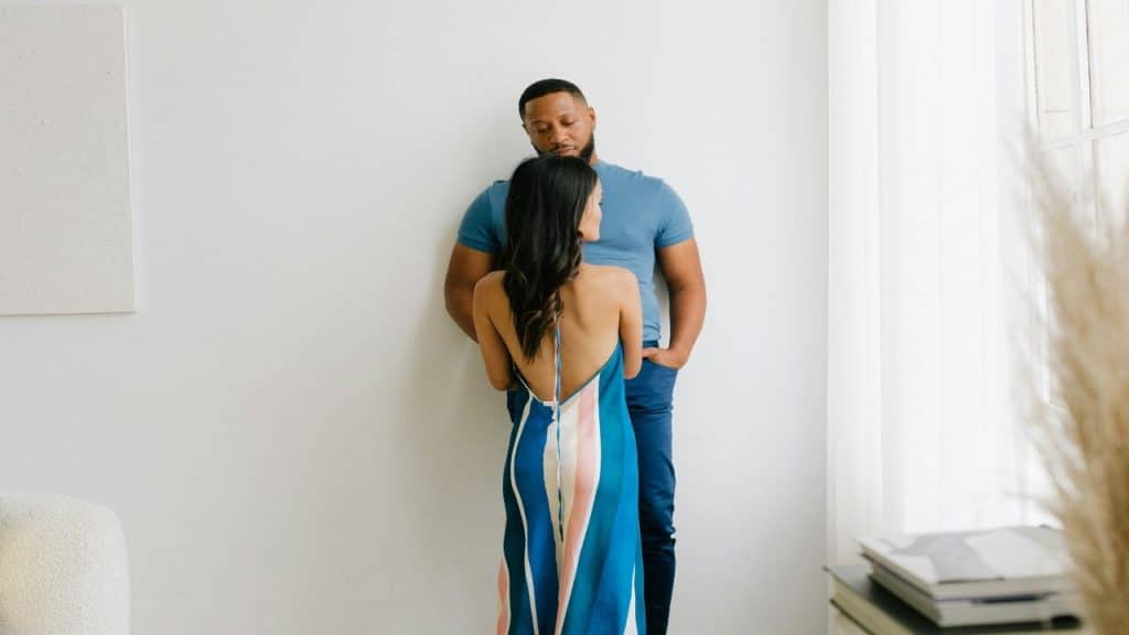 A couple looking sad at home