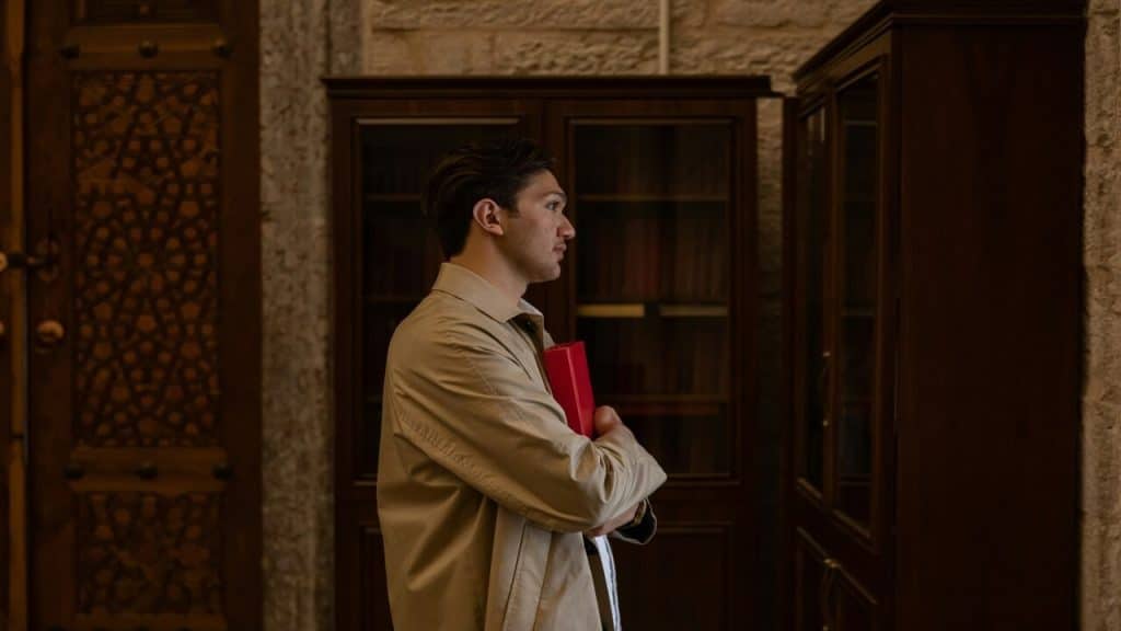 A man standing quietly at work