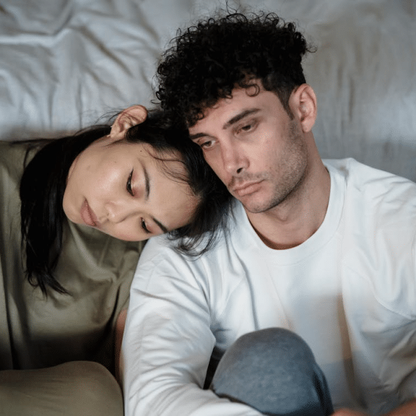 Unhappy Couple Sitting Together