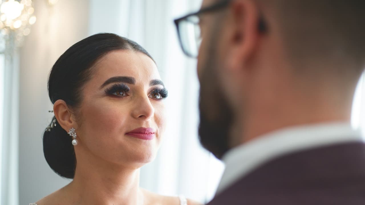 A beautiful woman is looking at her husband.