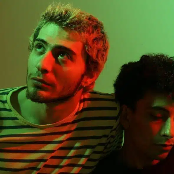 Two men and there is a red and green light