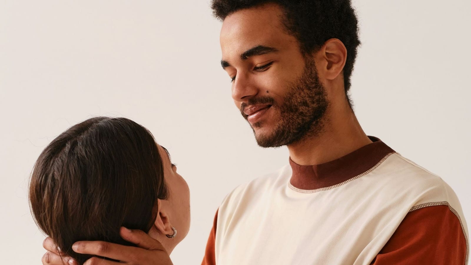 A man holding a woman