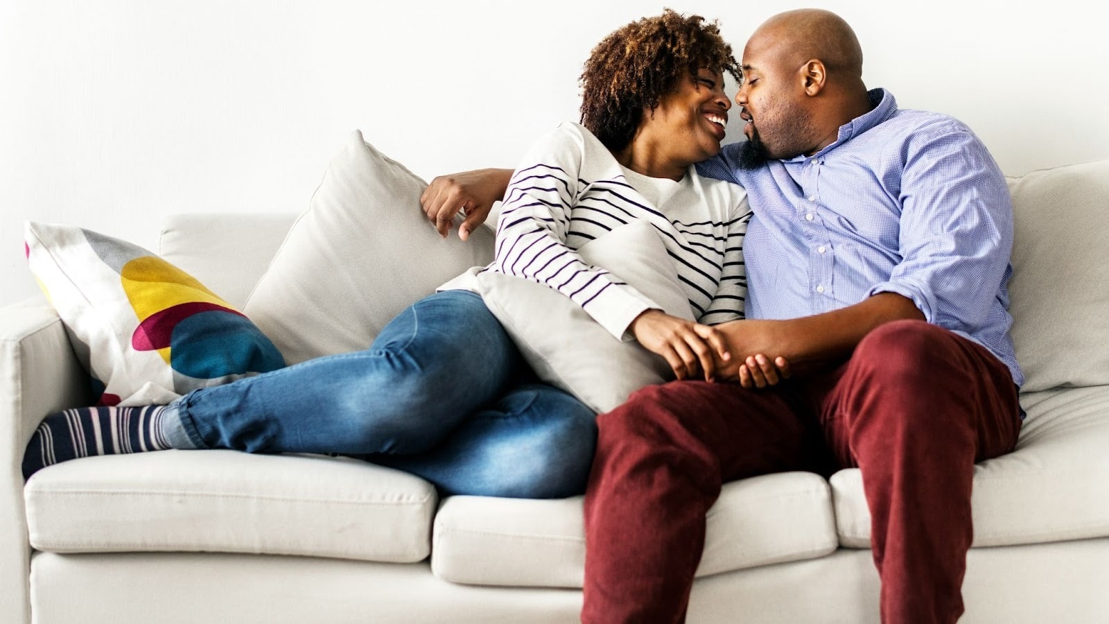 A man and woman at the sofa
