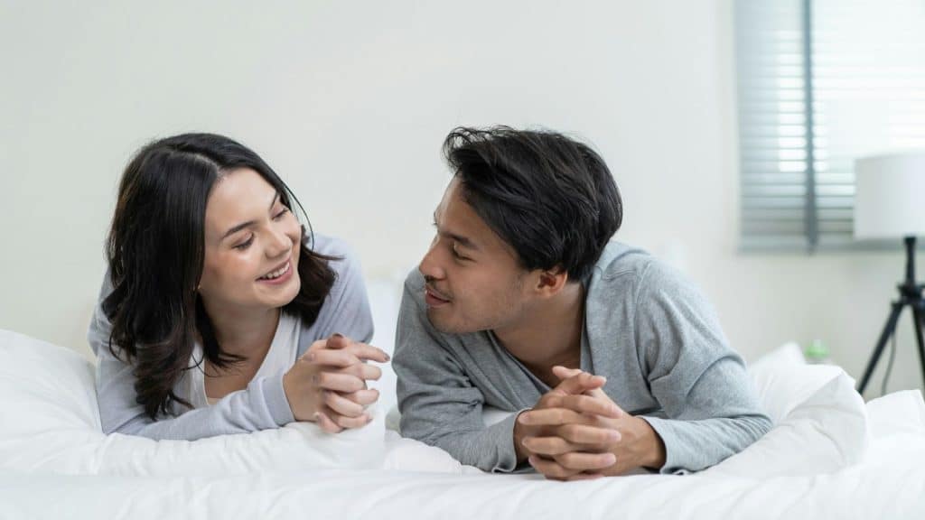 A man and woman smiling at each other