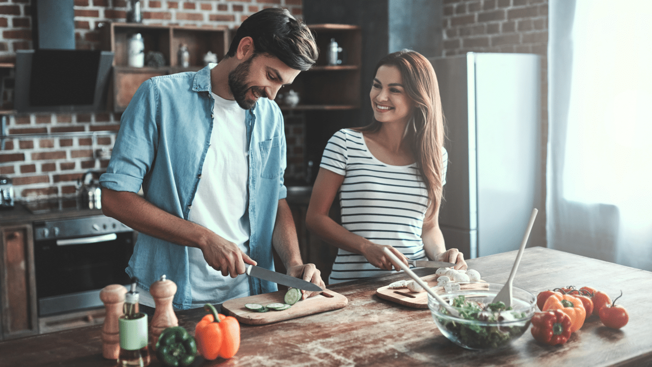 A couple busy in the kitchen