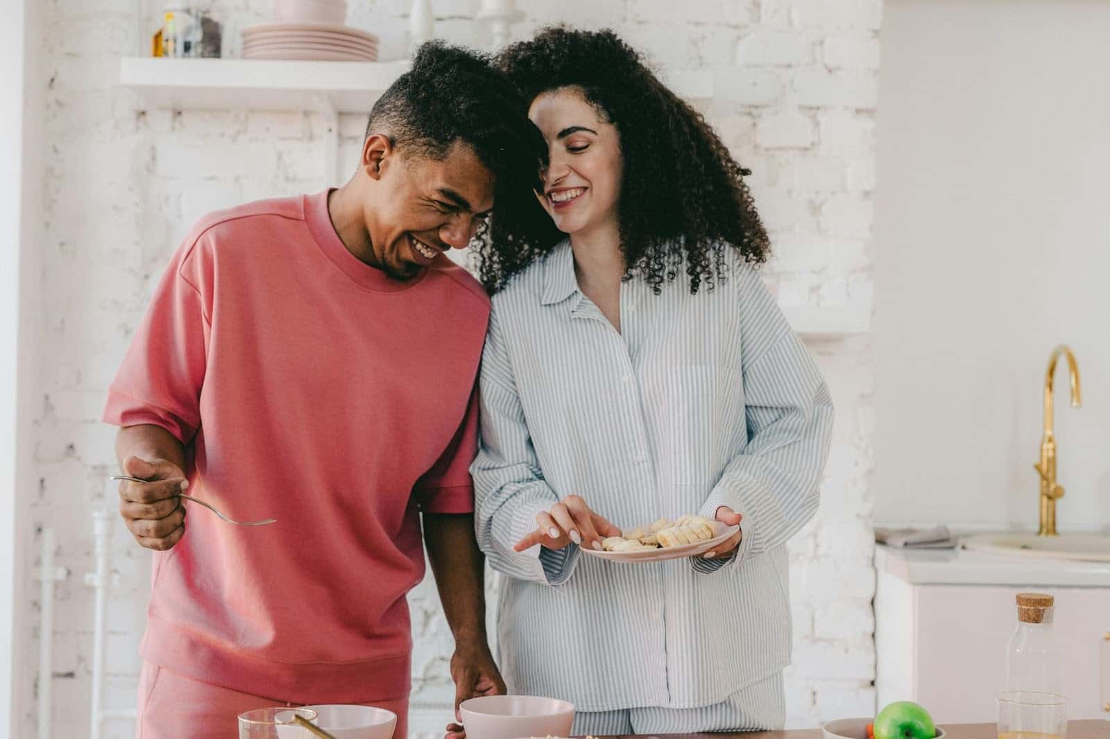 A man and a woman in the kitchen