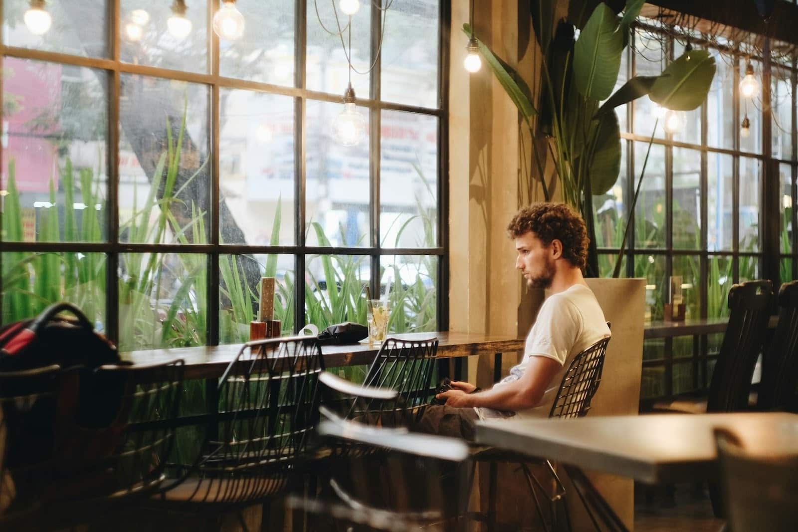 A man sitting alone in a coffee shop