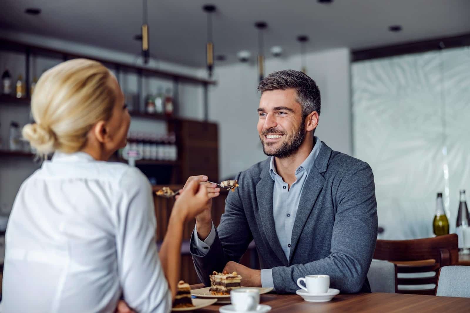 A couple talking in a coffee shop