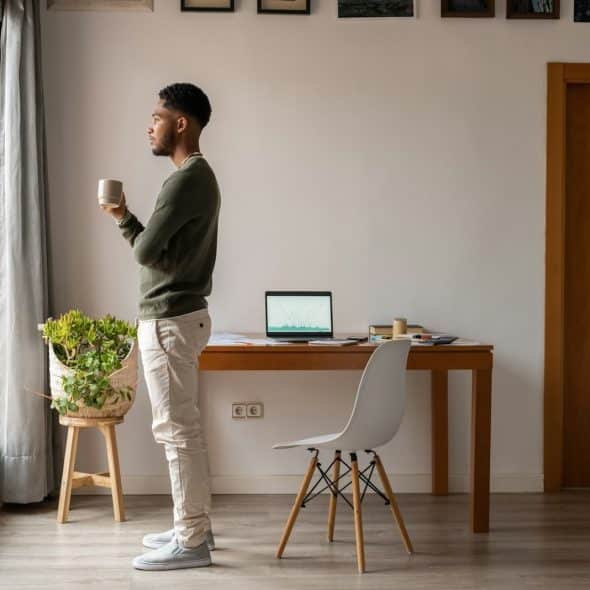A thoughtful man indoors with natural light