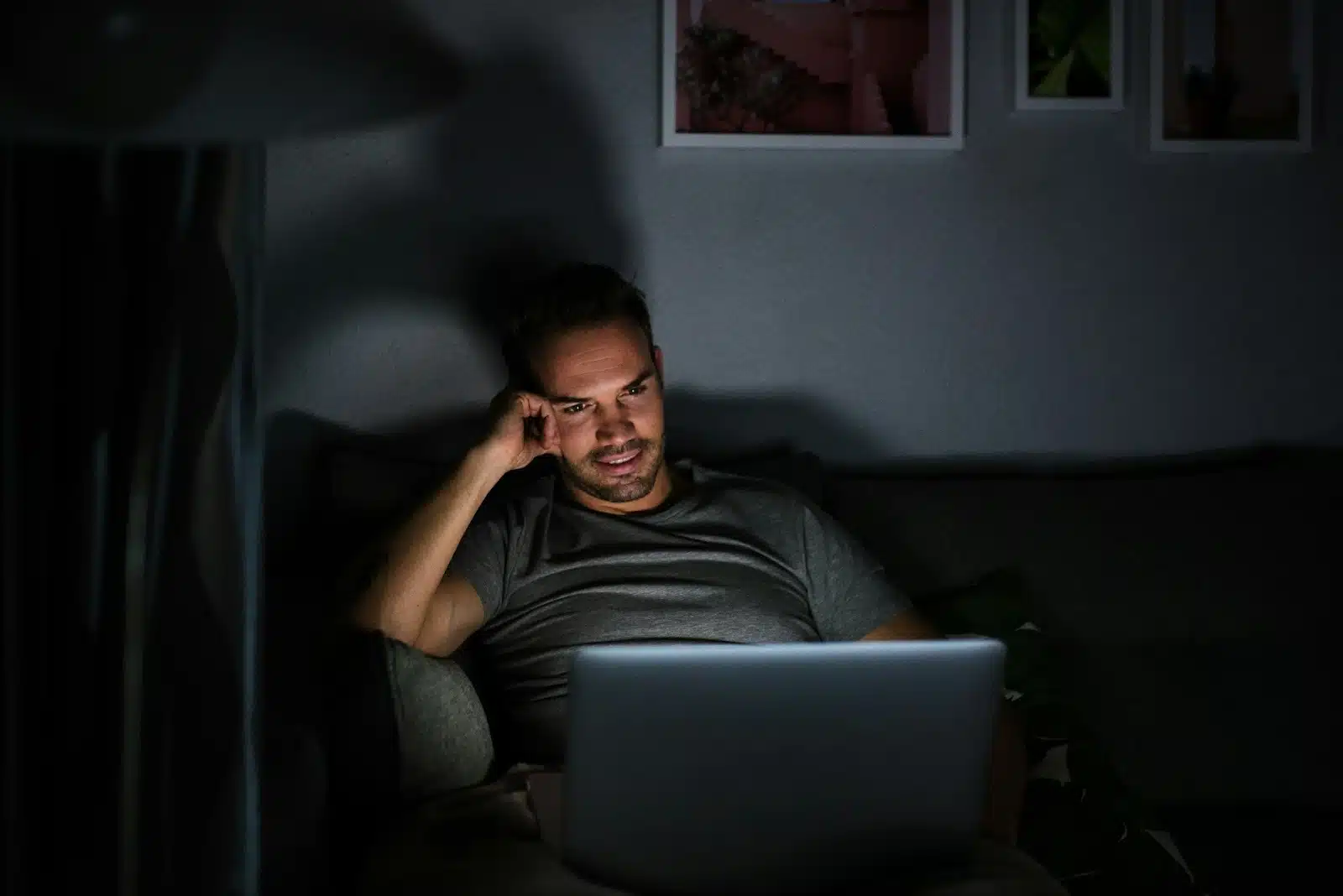 A man watching to his laptop alone