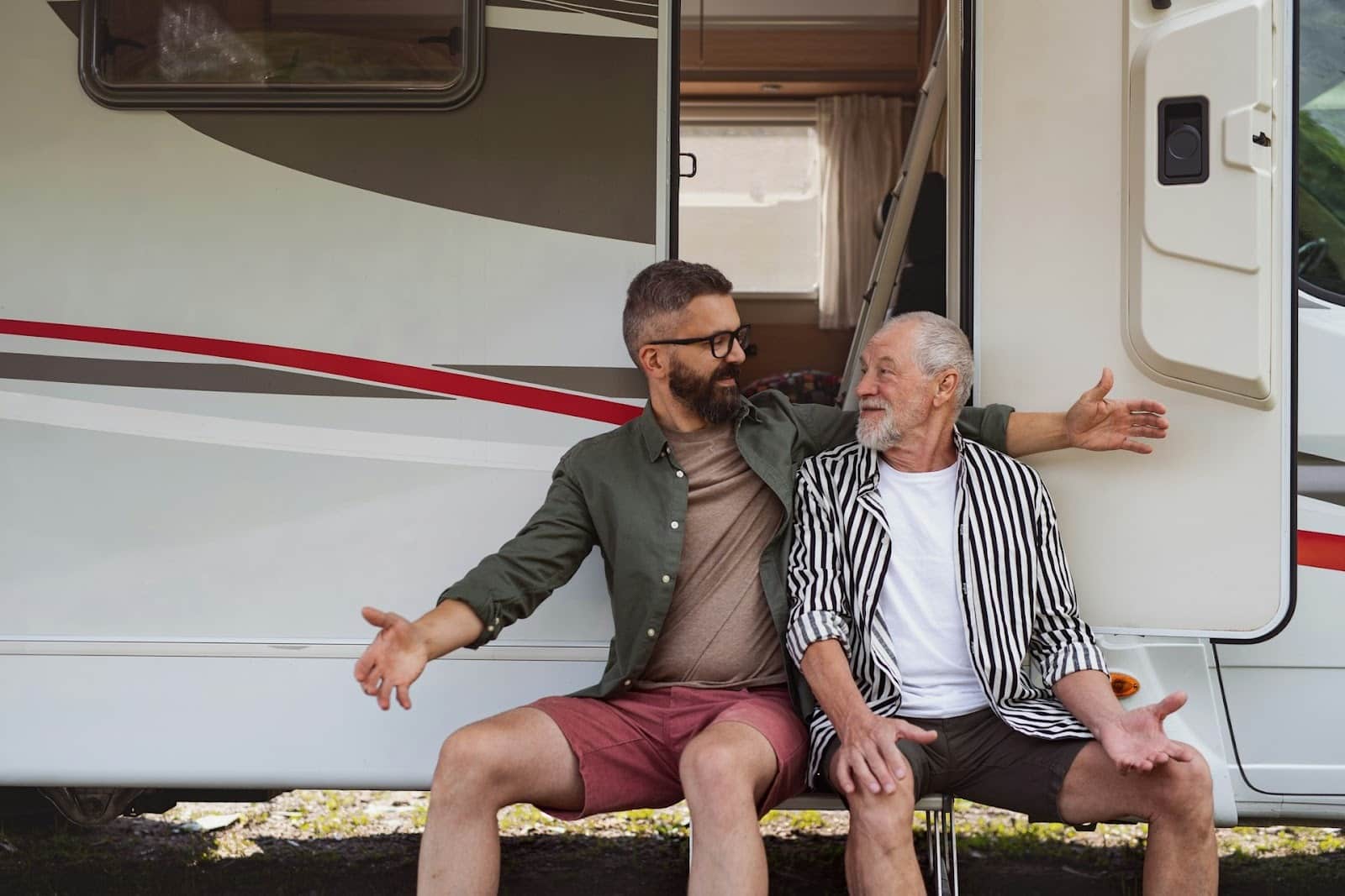 Two men having an open conversation outside