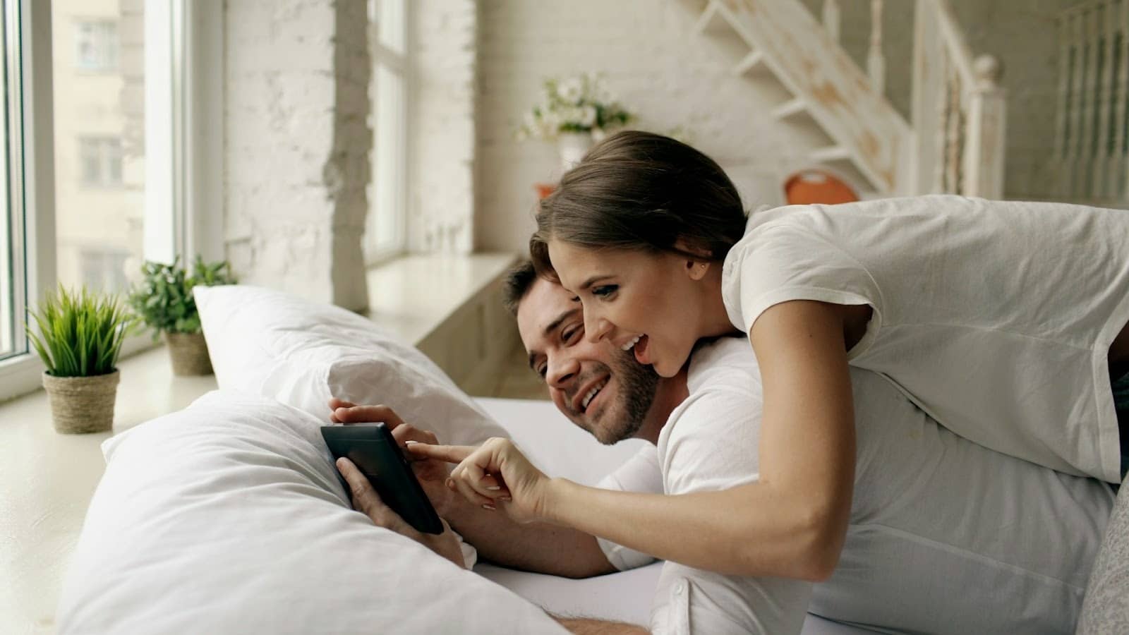 Affectionate partners indoors natural light