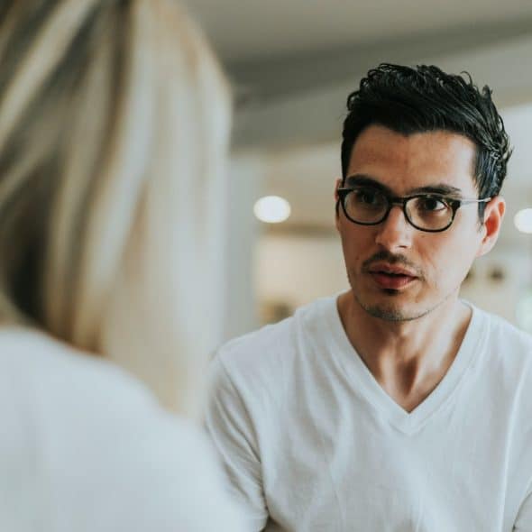 A man in a serious conversation