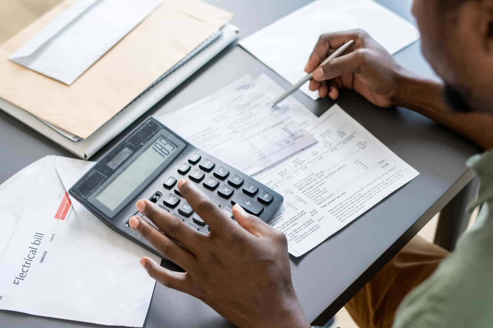 A man computing bills