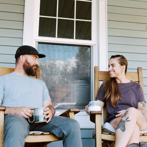 A couple having a conversation outdoors