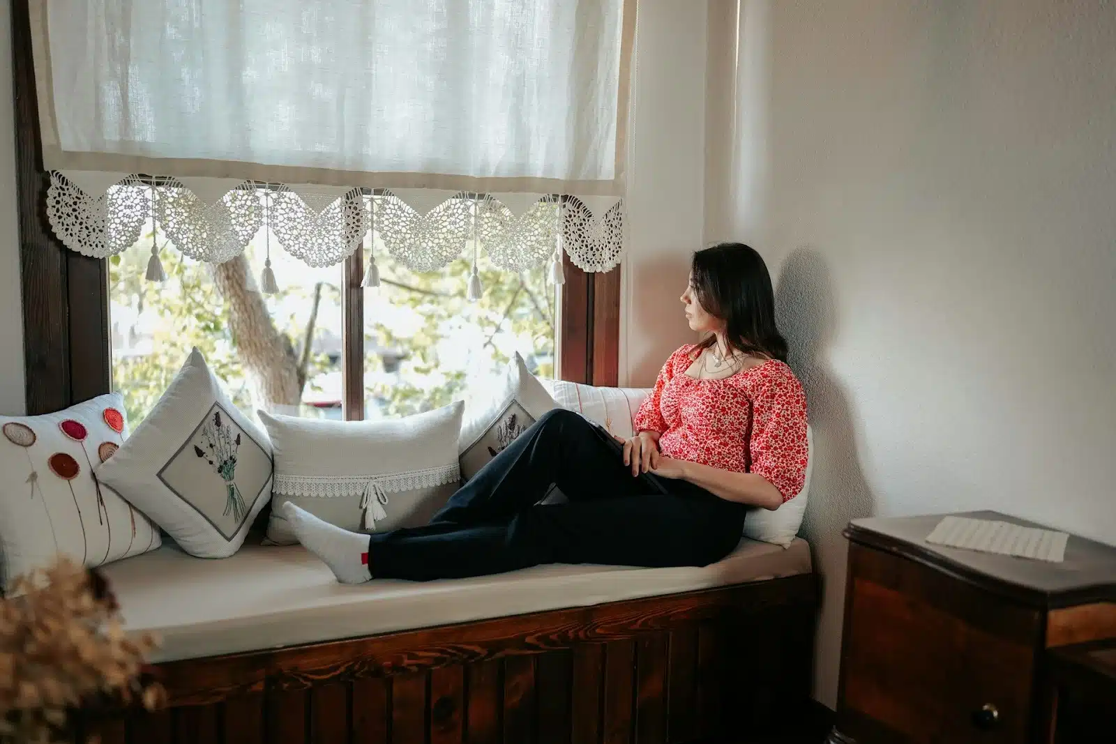 A woman looking at window