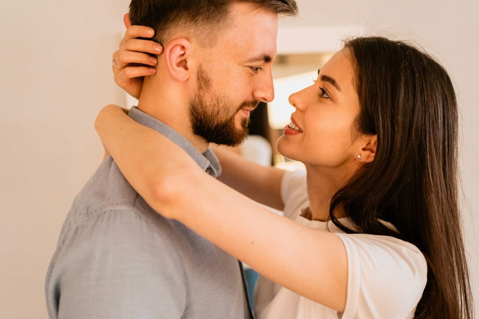 A couple hugging and looking at each other