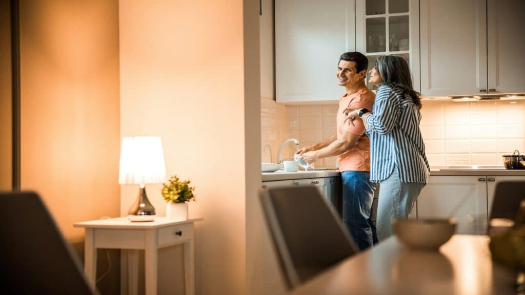 A mature couple in the kitchen