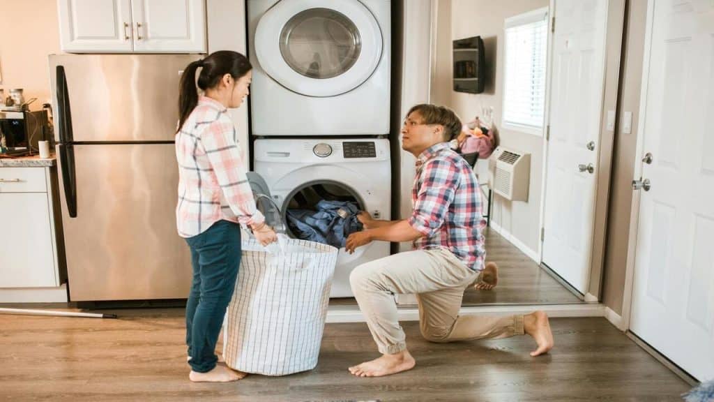 A couple doing laundry together