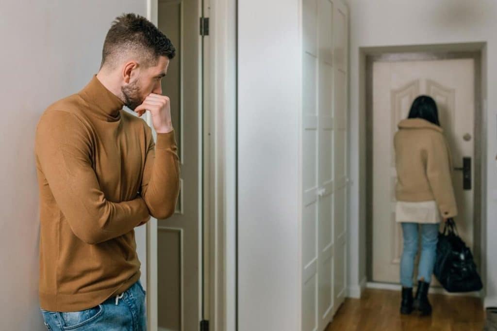 A woman walking out of the apartment
