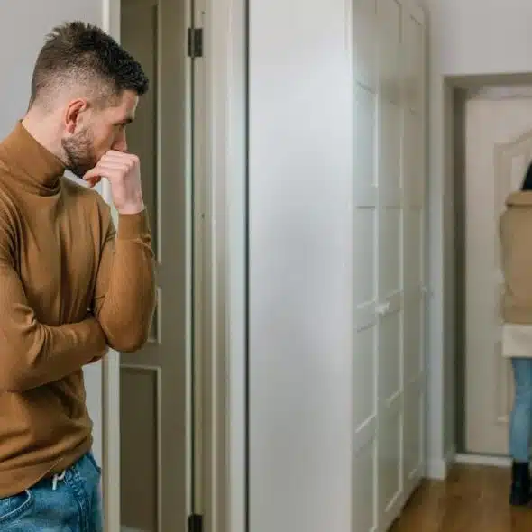 A woman walking out of the apartment