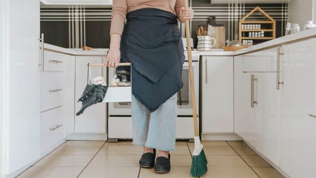 A woman cleaning the kitchen