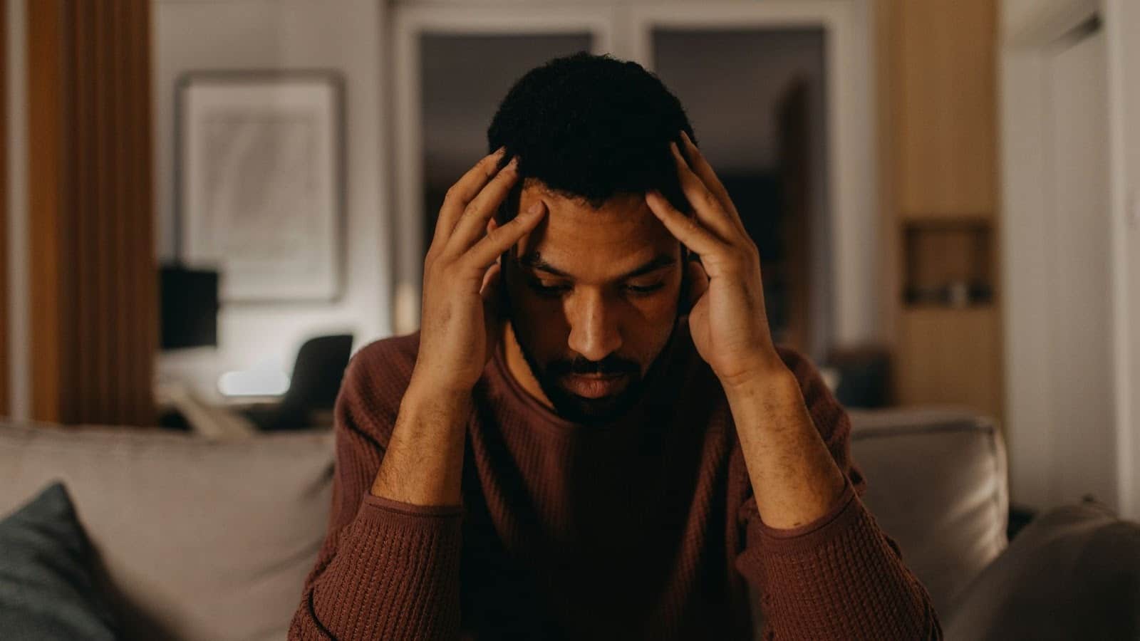 A man holding his head because of stressed