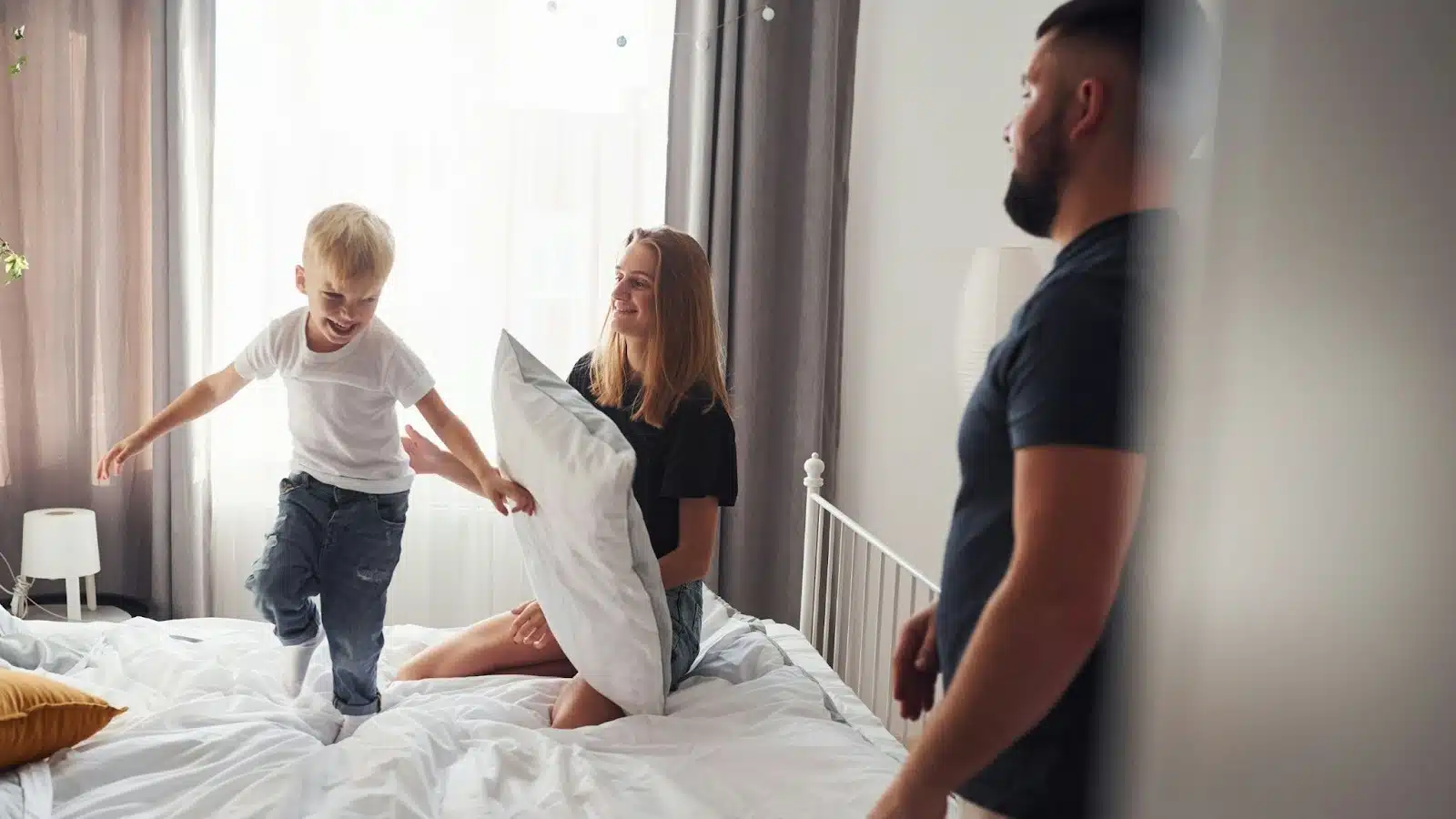 A man just looking at the woman and a child