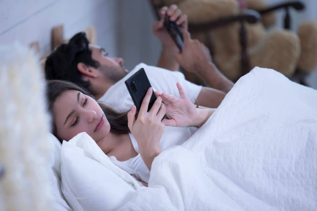 couple distracted phones