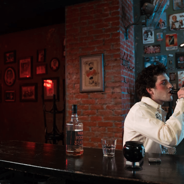 A Man Drinking Beer in the Bar