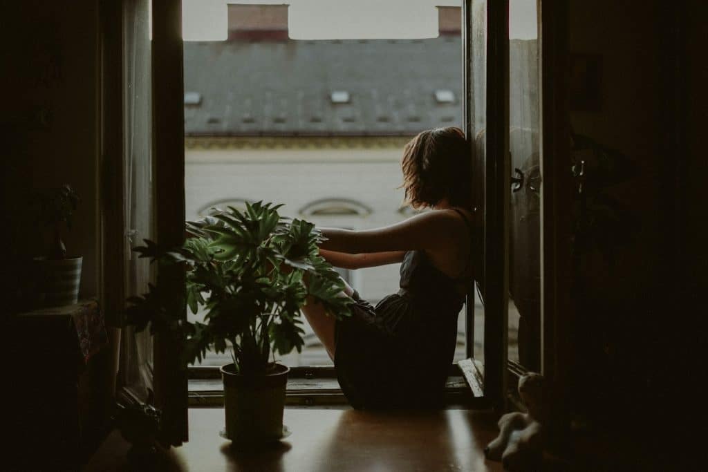 thoughtful woman window