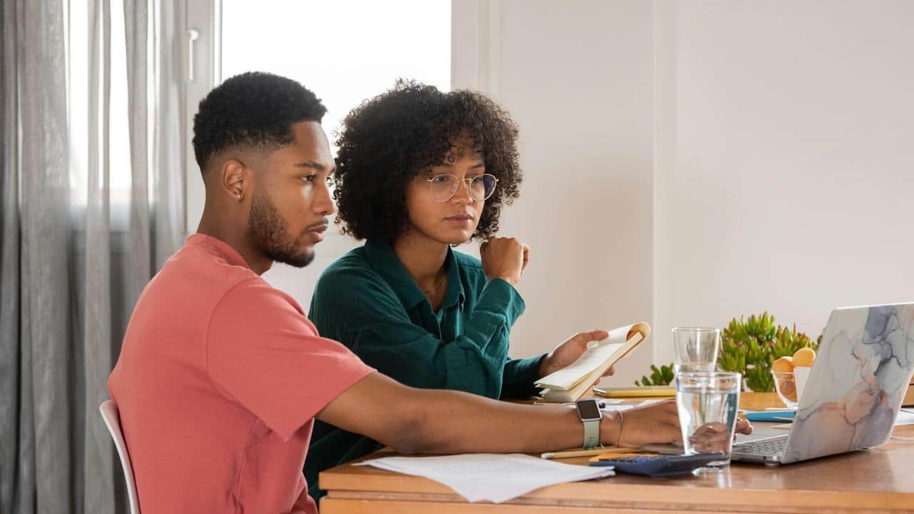 A couple looking at a laptop