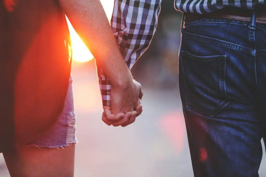 holding hands sunrise
