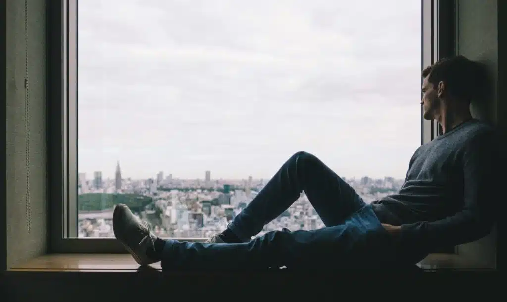 A man looking out the window