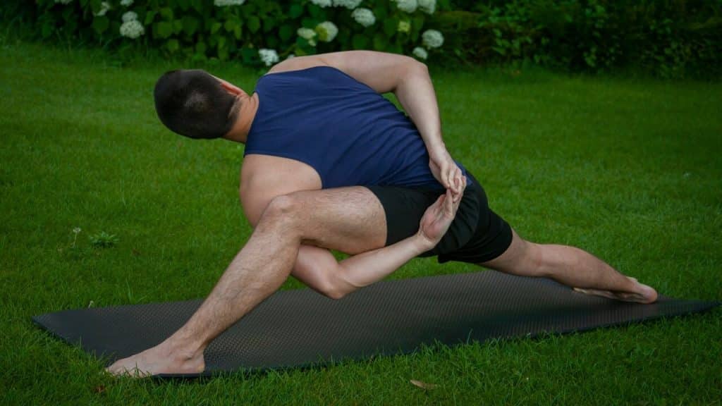 A man stretching outdoors