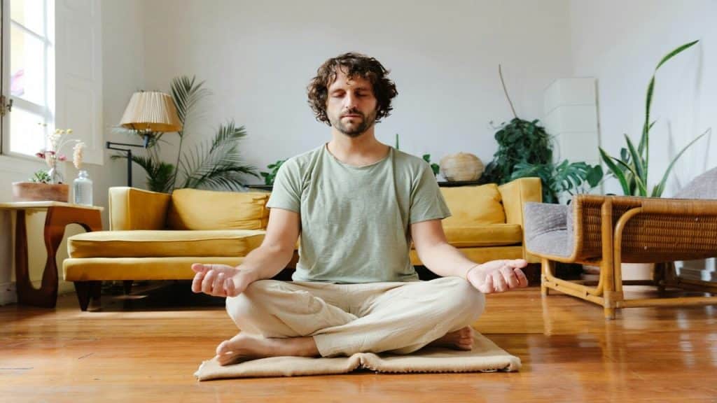 A man doing yoga at home