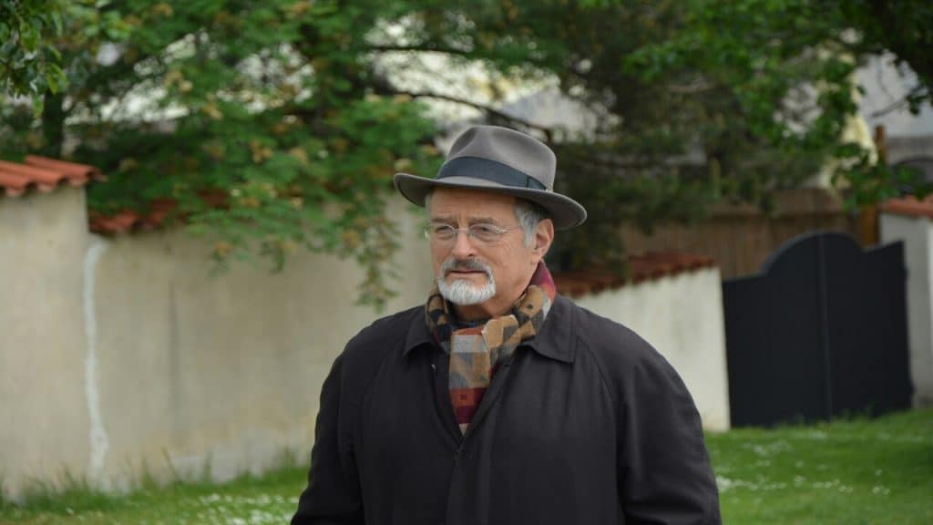 A man wearing a coat and a hat