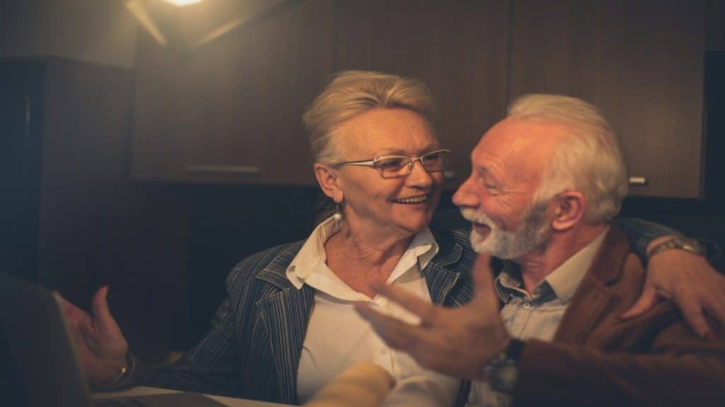 An older couple arguing but still smiling