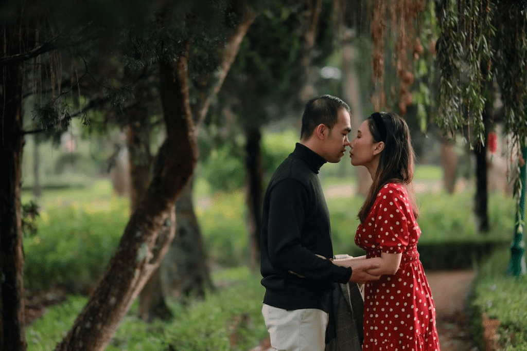 Romantic Couple Kissing in an Outdoor Park