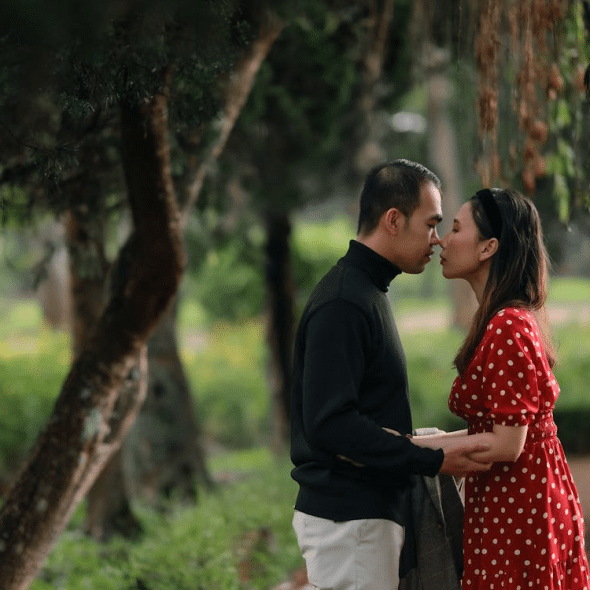 Romantic Couple Kissing in an Outdoor Park